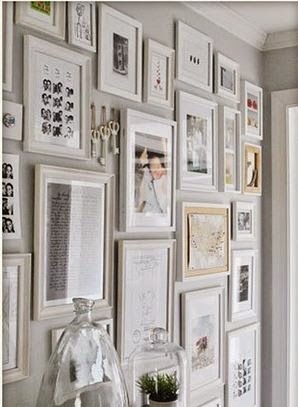 Create a Perfect Photo Montage Gallery . A coat of dark taupe paint on the back wall warms things up and creates a focal point.